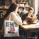 White canvas tote bag with "Reading Is My Favorite Sport" text, perfect for book lovers and bibliophiles.