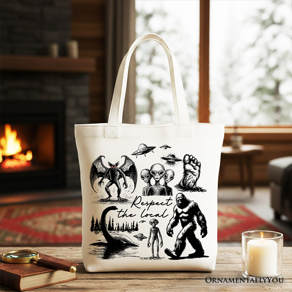 White tote bag featuring a humorous cryptid squad design with Bigfoot, Mothman, and alien illustrations, by OrnamentallyYou.