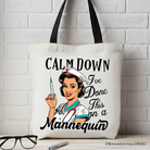 White Sassy Nursing School Tote Bag by OrnamentallyYou with humorous "Calm Down I've Done This" text on the front.