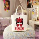 OrnamentallyYou Sister Things messy bun retro canvas tote bag with red bandana glasses design, perfect for family matching gift shoppers.