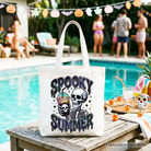 White Spooky Summer Skeleton Tote Bag by OrnamentallyYou featuring a humorous skeleton design, perfect for Halloween and horror fans.