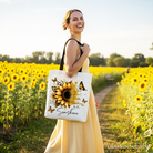 White canvas tote bag with sunflower and inspirational quote "When you can’t find the sunshine, be the sunshine" by OrnamentallyYou.