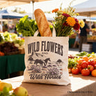 White canvas tote bag featuring wild flowers and wild horses design, perfect for free-spirited women, by OrnamentallyYou.