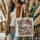 White canvas tote bag featuring wild flowers and wild horses design, perfect for free-spirited women, by OrnamentallyYou.
