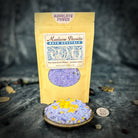 Small jar of Parlour of Wonders Absolute Power Bath Crystals with lavender and herbal ingredients, ideal for relaxing bath sessions.
