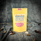 Small jar of Parlour of Wonders Faithful Marriage Bath Crystals with pink and white crystals for relaxing bath experience.