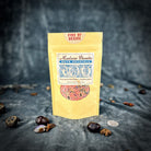 Small jar of Parlour of Wonders Fire of Desire Bath Crystals with colorful crystalline bath salts in a clear container.