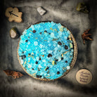 Small jar of Holy Healing Bath Crystals by Parlour of Wonders, featuring colorful bath crystals for relaxing bath experience.