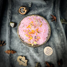 Small jar of Parlour of Wonders Self Love Bath Crystals with colorful crystals and calming packaging for a relaxing bath experience.