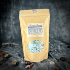 Small jar of Parlour of Wonders Spirit Guide Bath Crystals with colorful crystals for relaxing bath experience.