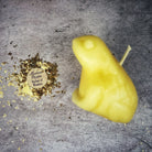 Black beeswax candle featuring a lucky money frog design, used for abundance and prosperity magic by Parlour of Wonders.