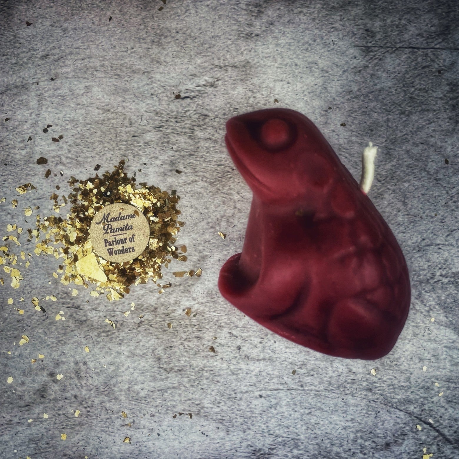Black beeswax Lucky Money Frog spell candle by Parlour of Wonders, used for abundance and prosperity magic.