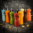 Black beeswax candle with a binding knot design, used for strengthening bonds and controlling harm in spiritual rituals.