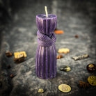 Black beeswax binding knot spell candle from Parlour of Wonders, designed for strengthening bonds and protecting against harm.