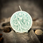 Blue beeswax Aquarius Water Bearer zodiac spell candle by Parlour of Wonders with intricate zodiac symbols and a calming design.