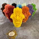 Blue beeswax Hamsa Hand spell candle by Parlour of Wonders for evil eye protection and blessing magic.