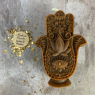 Blue beeswax Hamsa hand spell candle by Parlour of Wonders for evil eye protection and blessing magic.
