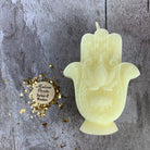 Blue beeswax Hamsa Hand spell candle by Parlour of Wonders for evil eye protection and blessing magic.