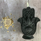 Blue beeswax Hamsa hand spell candle by Parlour of Wonders for evil eye protection and blessing magic.