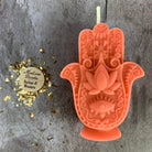 Blue beeswax Hamsa hand spell candle by Parlour of Wonders for evil eye protection and blessing magic.