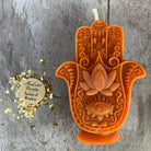 Blue beeswax Hamsa hand spell candle by Parlour of Wonders for evil eye protection and blessing magic.