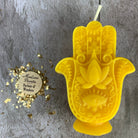Blue beeswax Hamsa hand spell candle by Parlour of Wonders for evil eye protection and blessing magic.