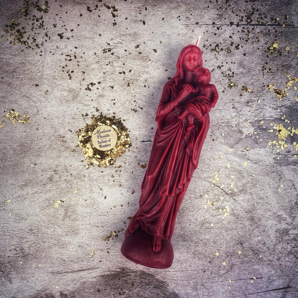 Blue beeswax Mother Mary spell candle by Parlour of Wonders for divine protection and unconditional love magic.