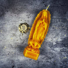 Blue beeswax candle featuring Nuestra Señora de Guadalupe, symbolizing divine mother and miracles, by Parlour of Wonders.