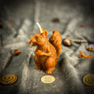 Brown beeswax squirrel of abundance spell candle by Parlour of Wonders, grounding and designed for prosperity and savings.