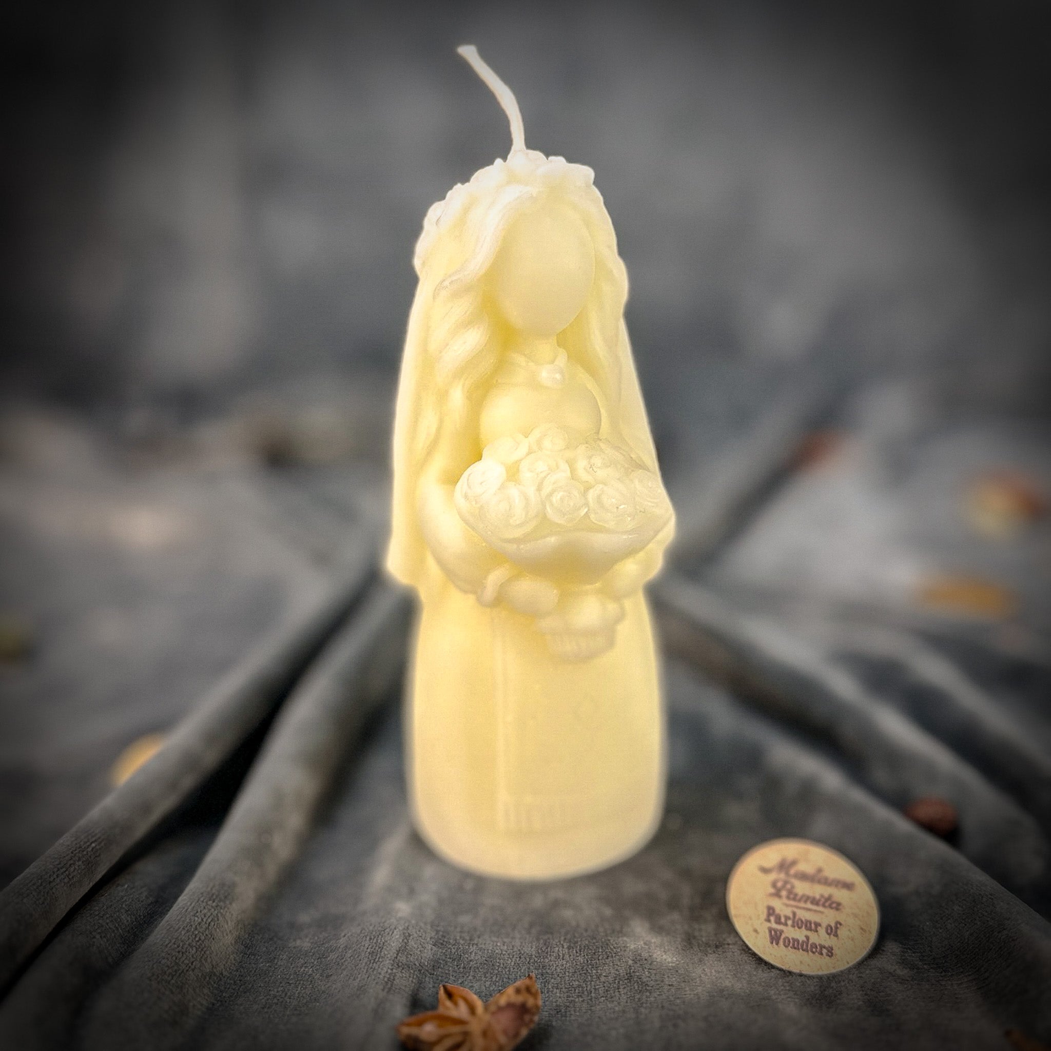 Beeswax Lada Motanka spell candle by Parlour of Wonders with squirrel design for blessings, love, protection, and abundance.