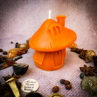 Green beeswax mushroom fairy hut candle by Parlour of Wonders, cozy fairy home with magical, natural beeswax finish.