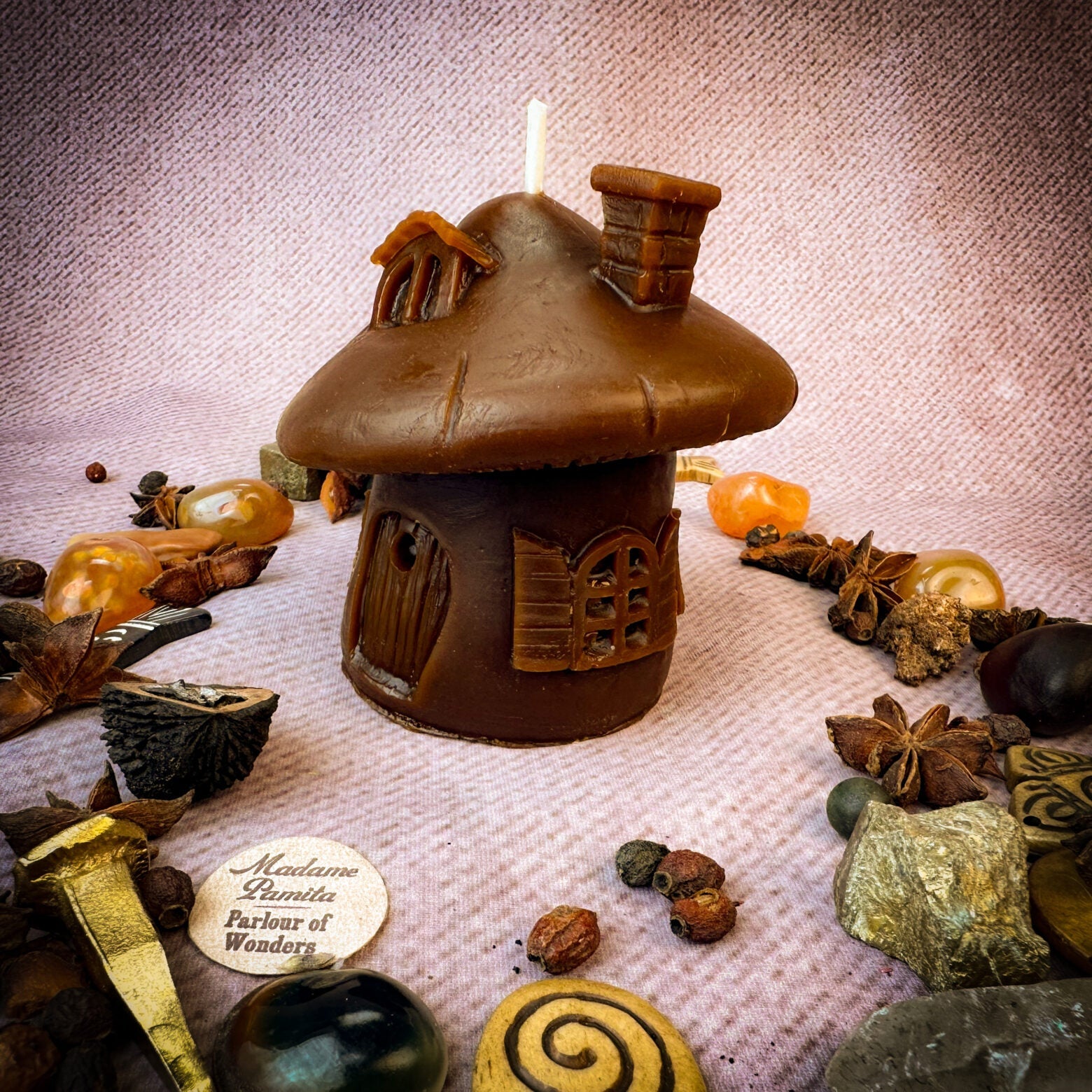 Green beeswax fairy mushroom hut candle by Parlour of Wonders, cozy magical home decor for sanctuary and blessing rituals.