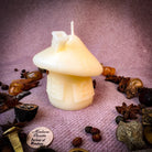 Green beeswax mushroom fairy hut candle by Parlour of Wonders, featuring a cozy fairy home design for sanctuary and blessing magic.
