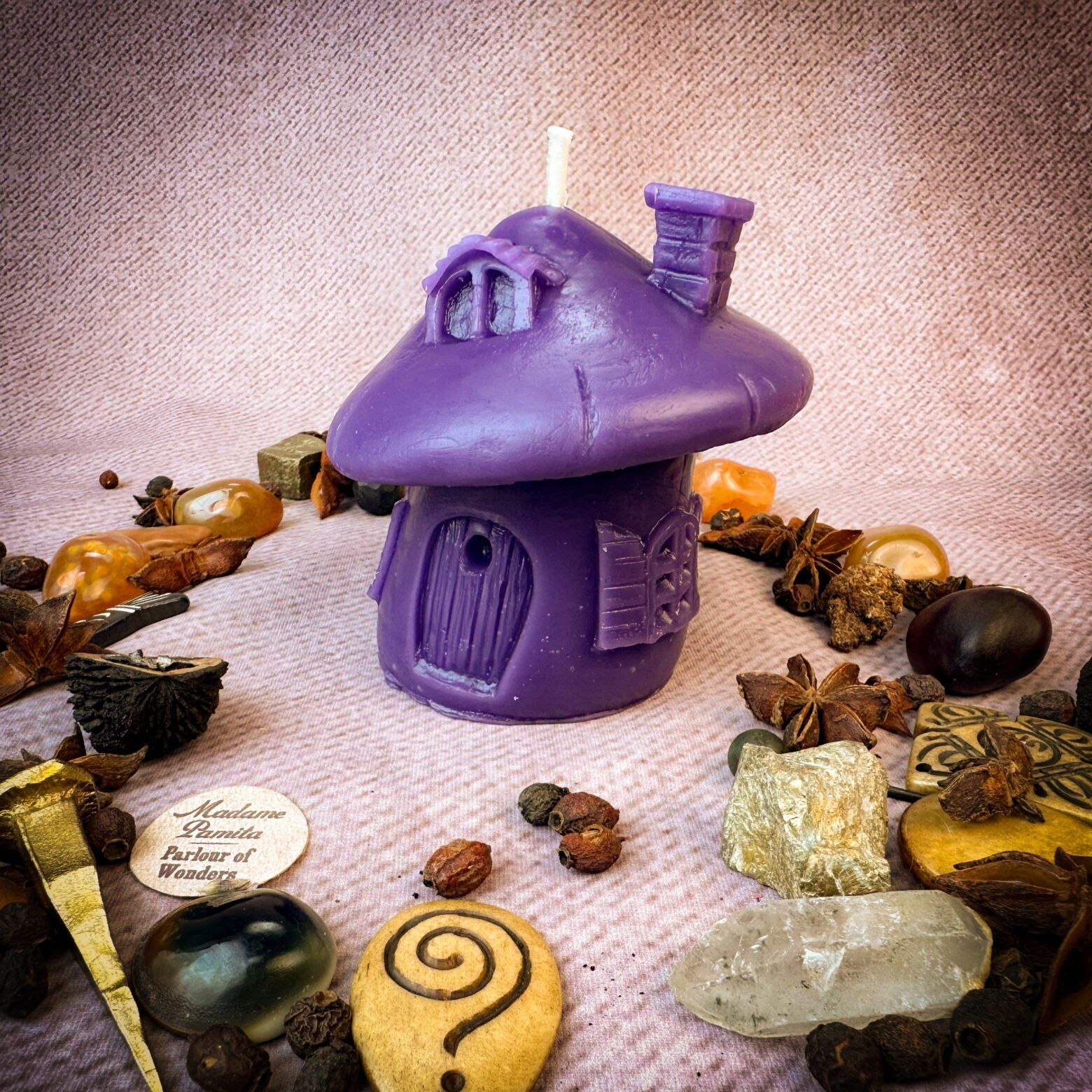 Green beeswax mushroom fairy hut candle by Parlour of Wonders, featuring a cozy fairy home design with magical, earthy details.