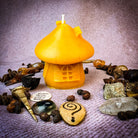 Green beeswax fairy mushroom hut candle by Parlour of Wonders, cozy home decor and magical sanctuary candle with intricate mushroom design.