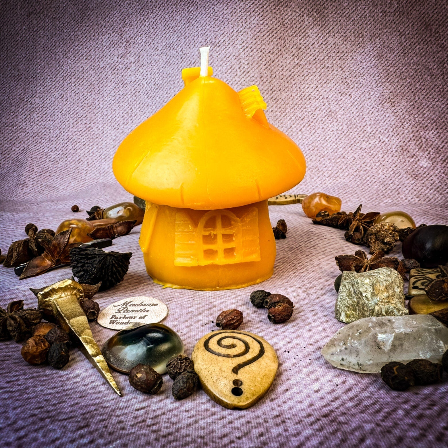 Green beeswax fairy mushroom hut candle by Parlour of Wonders, cozy home decor and magical sanctuary candle with intricate mushroom design.