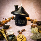 Green beeswax mushroom fairy hut candle from Parlour of Wonders, designed as a cozy fairy home with intricate mushroom details.