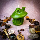 Green beeswax mushroom fairy hut candle by Parlour of Wonders, crafted as a cozy fairy home for sanctuary and magic.