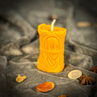 Green beeswax candle by Parlour of Wonders for debt collection and fair compensation, featuring a natural beeswax design.