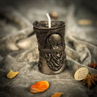 Green beeswax candle by Parlour of Wonders for debt collection and fair compensation, featuring a natural beeswax finish.