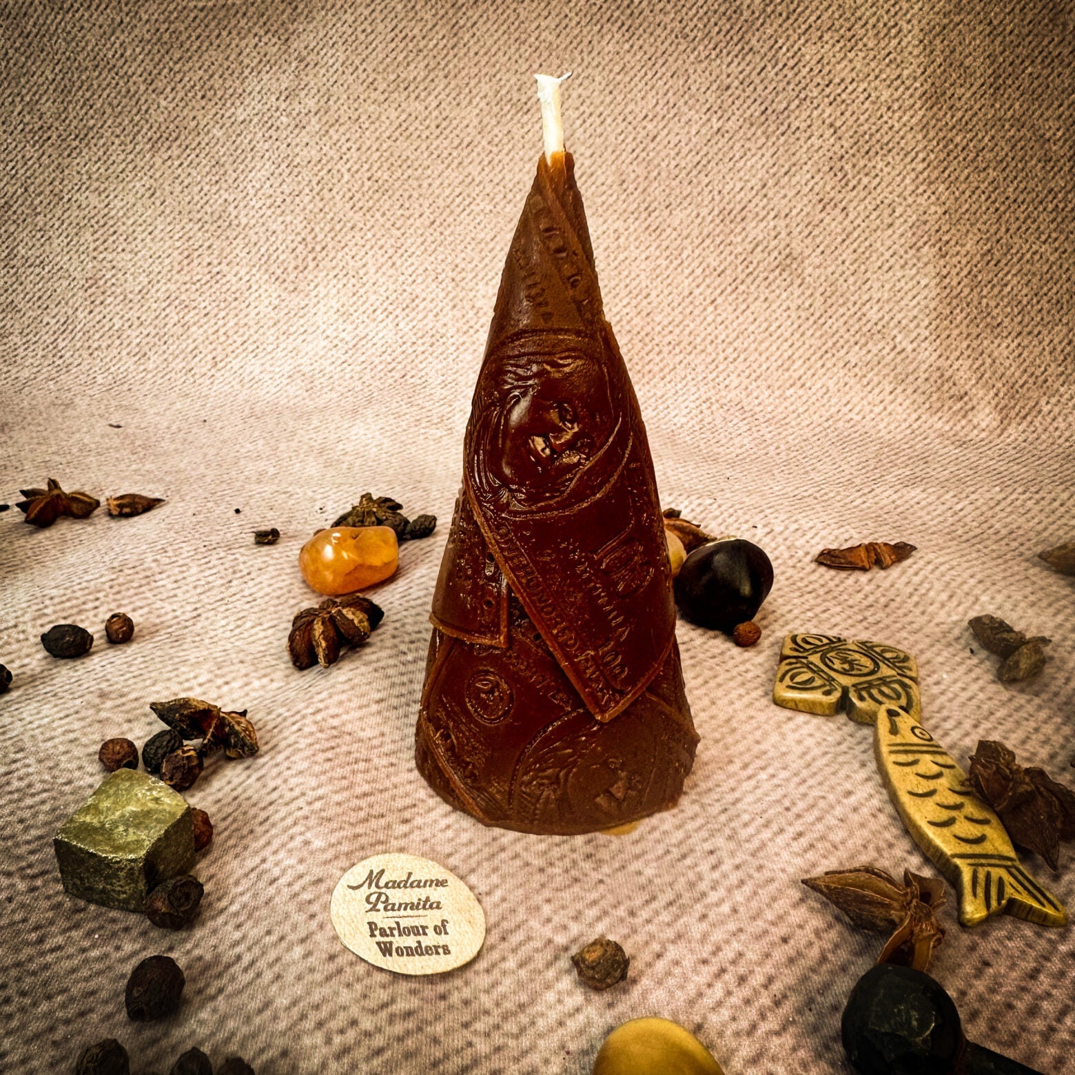 Green beeswax candle by Parlour of Wonders for prosperity and abundance magic, featuring a beeswax Money Maker spell design.