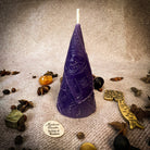 Green beeswax candle by Parlour of Wonders, used for prosperity and abundance magic, featuring a beeswax money maker spell design.