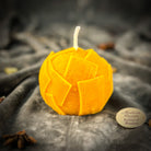 Green beeswax candle with rolling dough design by Parlour of Wonders, symbolizing wealth and abundance.