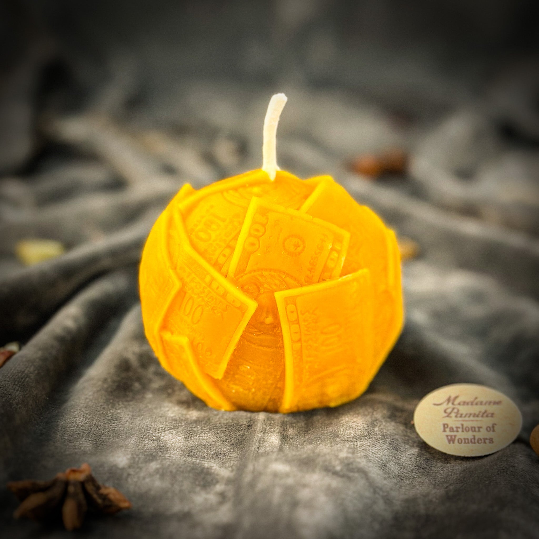 Green beeswax candle with rolling dough design by Parlour of Wonders, symbolizing wealth and abundance.