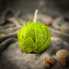 Green beeswax candle with rolling dough design by Parlour of Wonders, symbolizing wealth and abundance for luxury home decor.