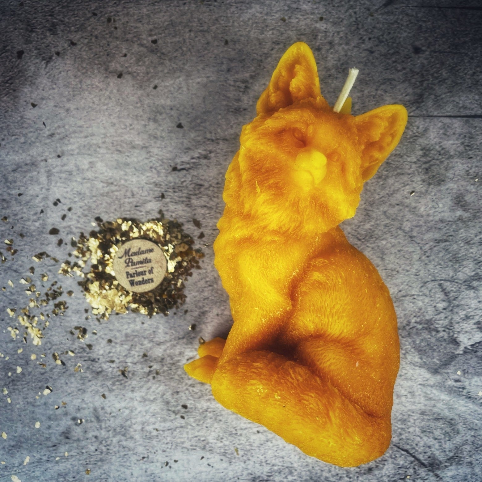 Orange beeswax candle by Parlour of Wonders, designed for quick results and cunning magic with a fox spell theme.