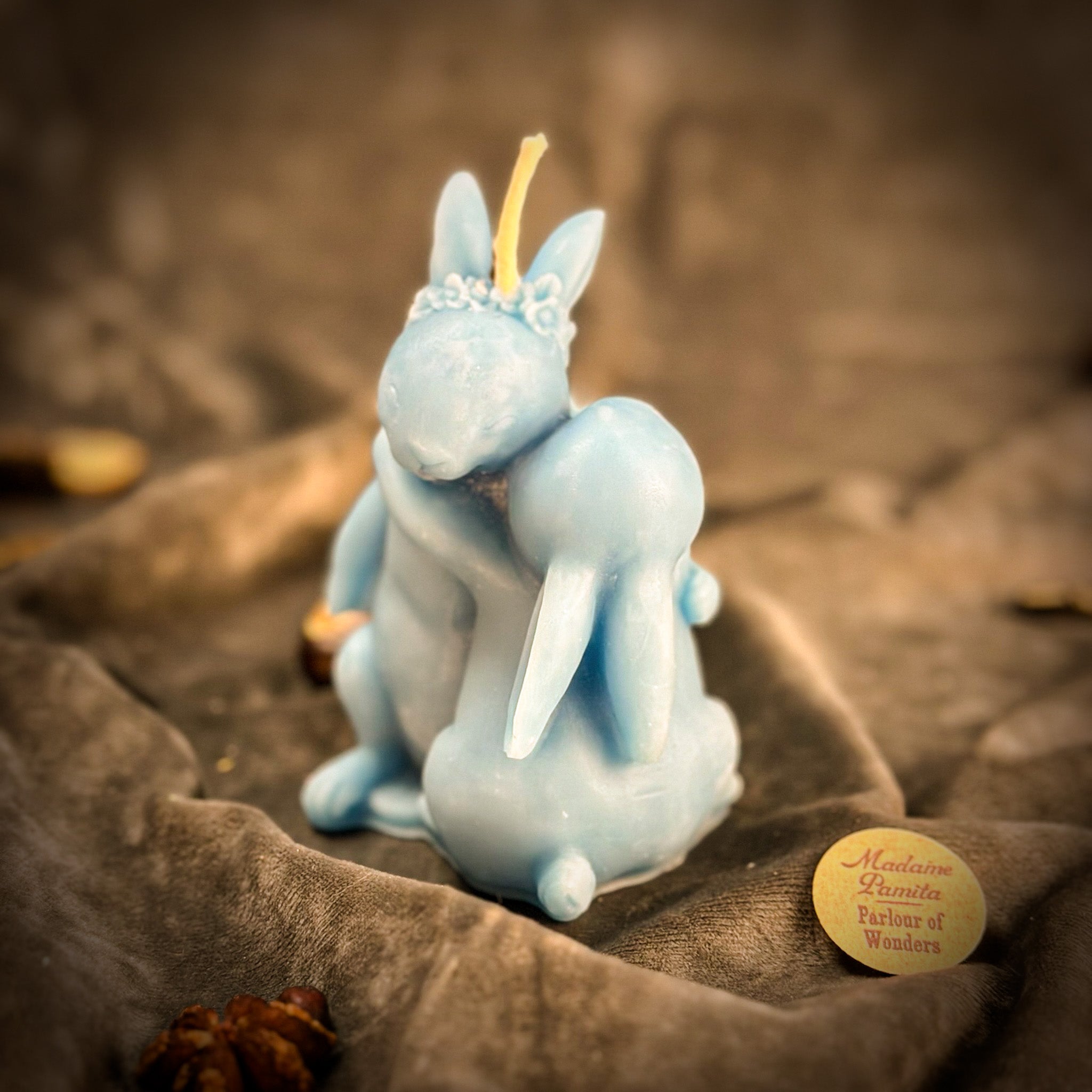 Beeswax Rabbit Spell Candle by Parlour of Wonders with orange wax, symbolizing good luck and new beginnings.