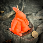 Parlour of Wonders beeswax rabbit spell candle in orange, symbolizing good luck and new beginnings, with detailed rabbit design.