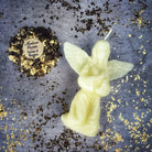 Orange beeswax angel spell candle by Parlour of Wonders, featuring detailed angel design for spiritual connection and divine blessings.