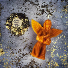 Orange beeswax angel spell candle by Parlour of Wonders, featuring intricate angel design for connecting with spirit guides and blessings.